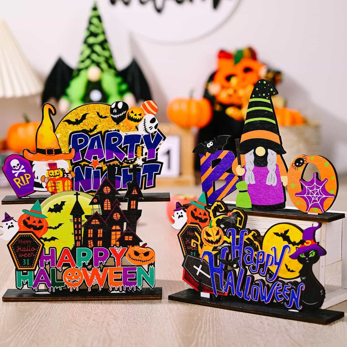 Spooky Scene Halloween tabletop decorations with gnomes, pumpkins, and "Happy Halloween" text.