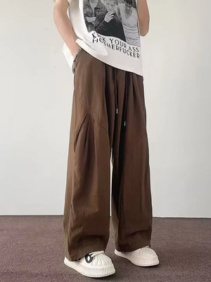 Brown relaxed fit casual cargo pants with drawstring waist and wide leg.
