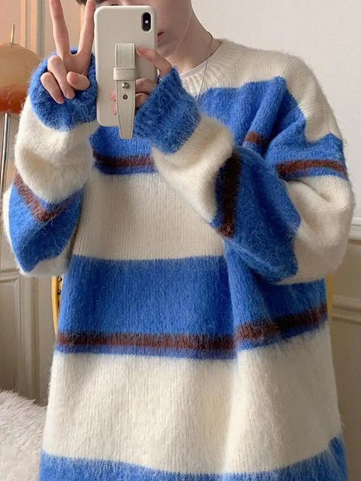 Blue and white striped fuzzy knit pullover sweater with brown accents.