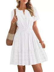 White textured V-neck tiered dress with smocked waist and short sleeves