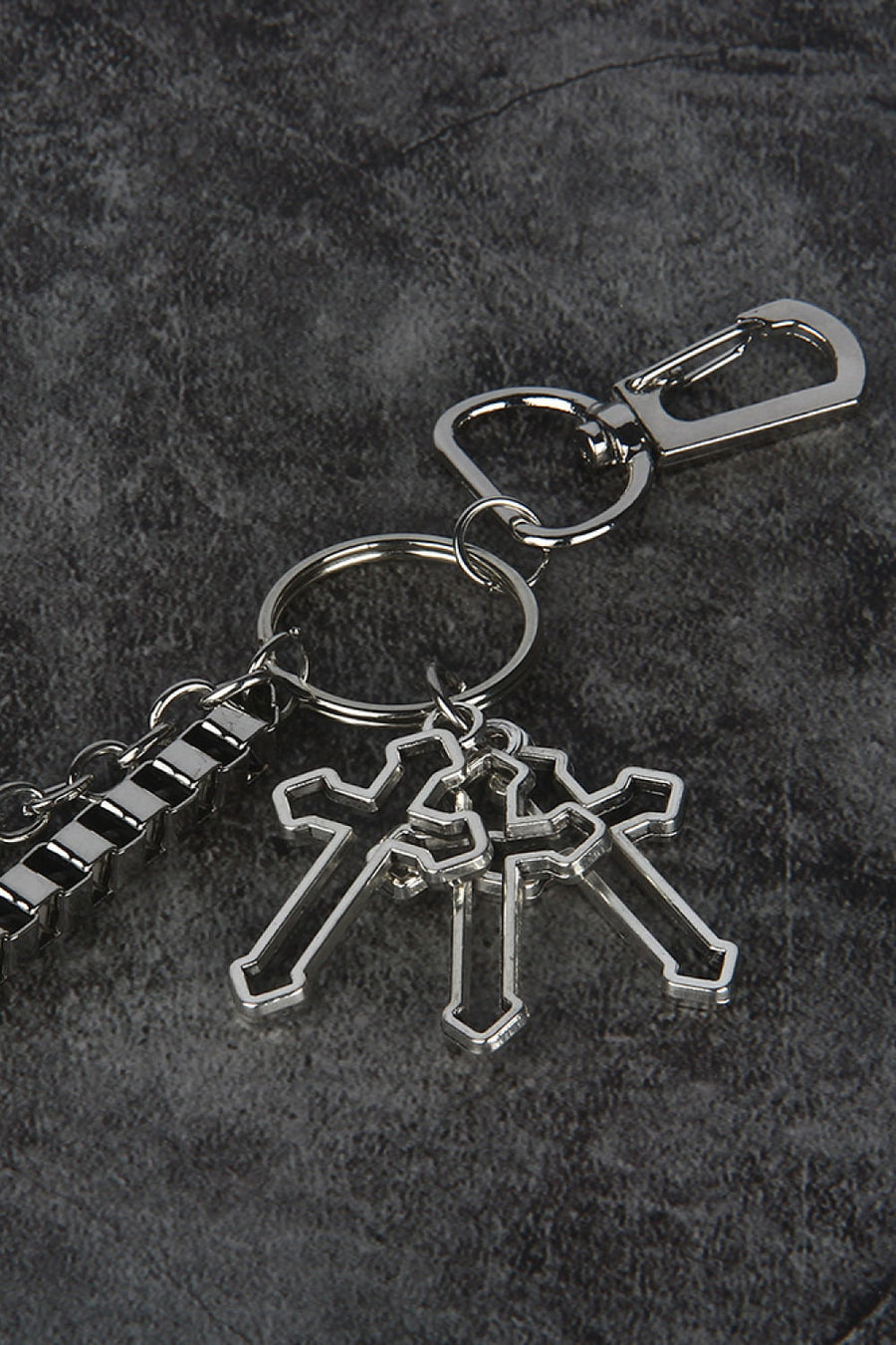 Silver geometric chain waist accessory with three crossed cross charms and a lobster clasp.