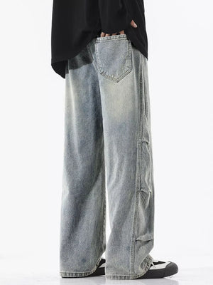 Light wash oversized wide leg jeans with distressed details and vintage fade.