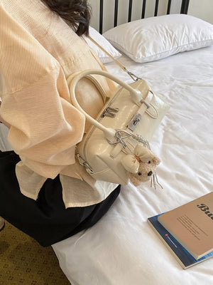 cream handbag with zip-front and geometric