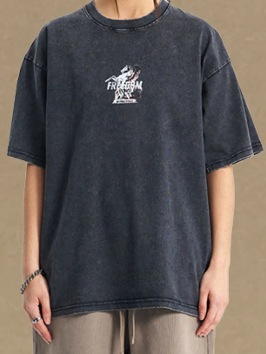 Black vintage wash t-shirt with a small graphic and text that says FREEDOM.