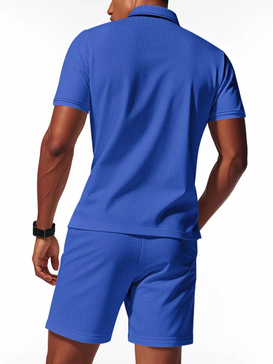 Royal blue textured polo shirt and shorts ensemble for men, short sleeves, collared.