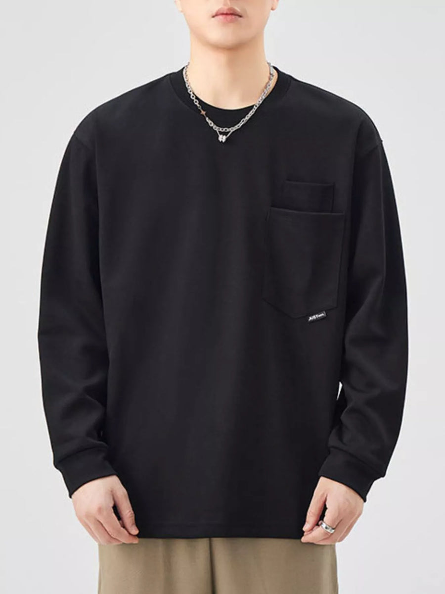 Black long-sleeve sweatshirt with crew neck and chest pocket.