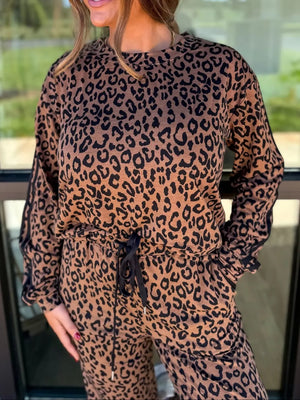 Leopard print loungewear set with drawstring joggers and long sleeve top.