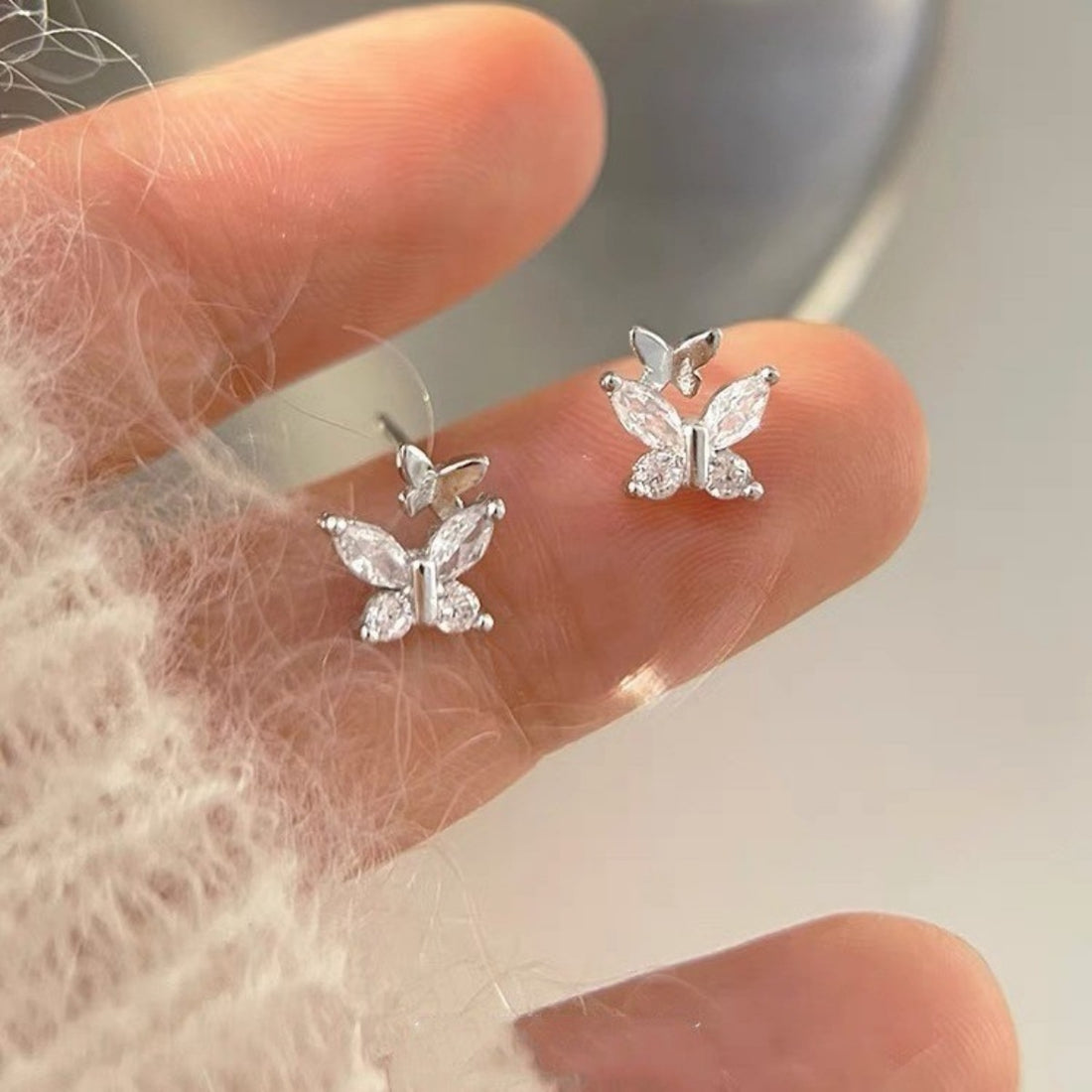 silver earrings with butterfly motif and not applicable