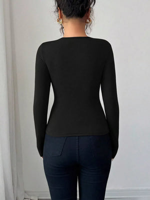Black long-sleeve tee with asymmetrical cutout detail.