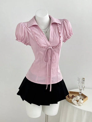button-up shirt in light pink featuring tied and fitted fit