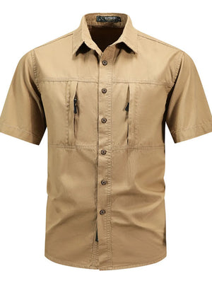 Men's tan cotton short sleeve button-down shirt with two zippered chest pockets.