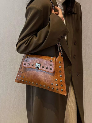 Brown embellished chain flap shoulder bag with silver studs and a silver clasp.