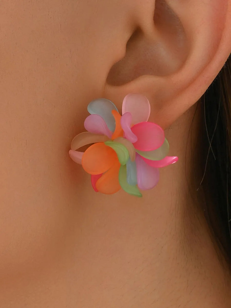 tangerine orange earrings featuring flower design and floral