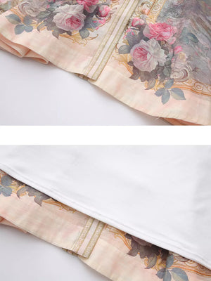Pastel floral print shirt dress with ornate border detail.