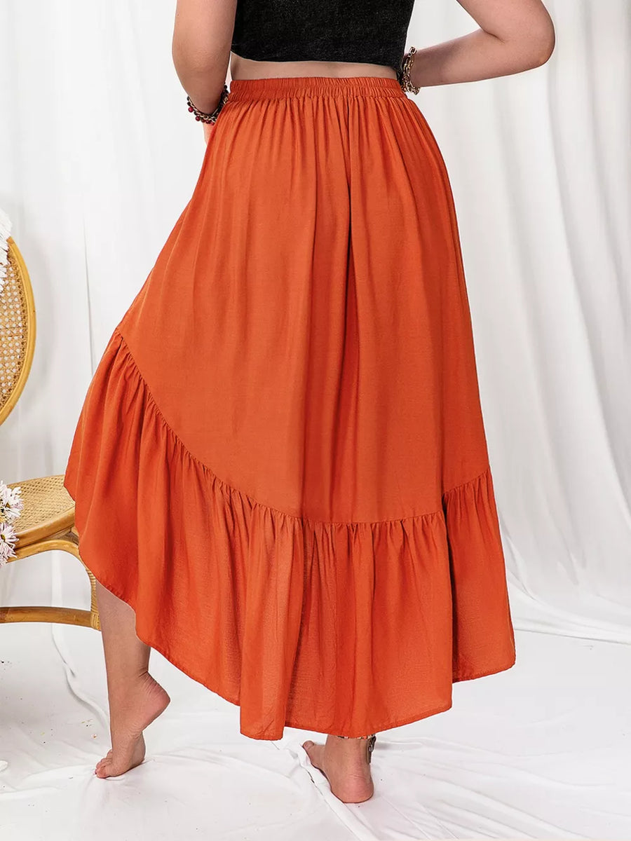 Orange ruched high-low skirt with ruffled hem, elastic waist, and flowy A-line cut.