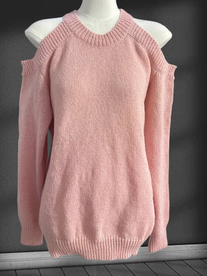 Pink knit cold shoulder sweater with crew neck and long sleeves.
