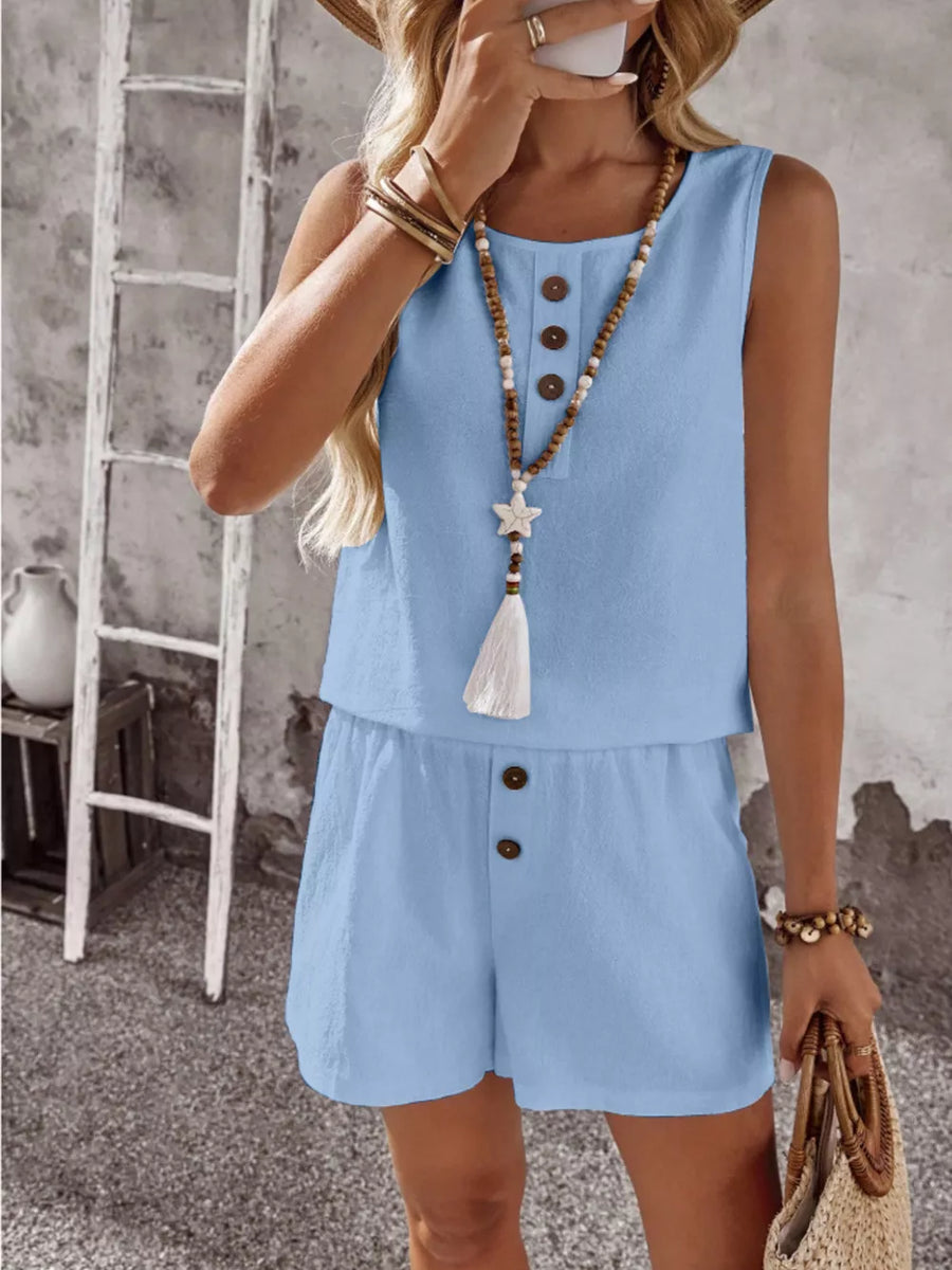 Sky blue cotton two-piece set with decorative buttons on the top and shorts.