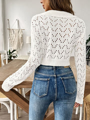 White cropped pointelle knit polo top with chevron pattern and long sleeves.