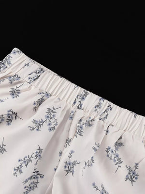 White floral print lounge pants with elastic waistband