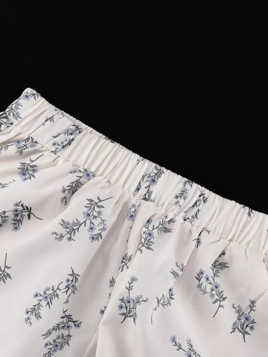 White floral print lounge pants with elastic waistband