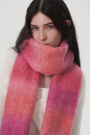 Gradient mohair scarf in hot pink with soft fringe detail.