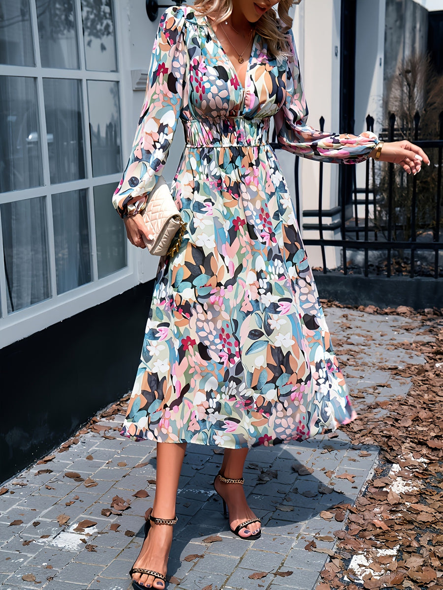 Floral print midi dress with V-neck, long sleeves, and smocked waist.