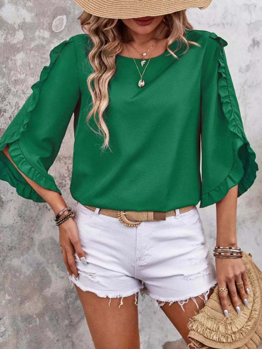Green ruffled sleeve blouse with button detail and split sleeves.