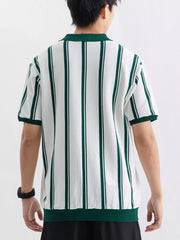 Men's white short sleeve polo with green vertical stripes and green collar.