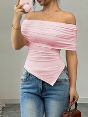 Pink asymmetrical ruched off-shoulder top with a draped neckline and handkerchief hem.