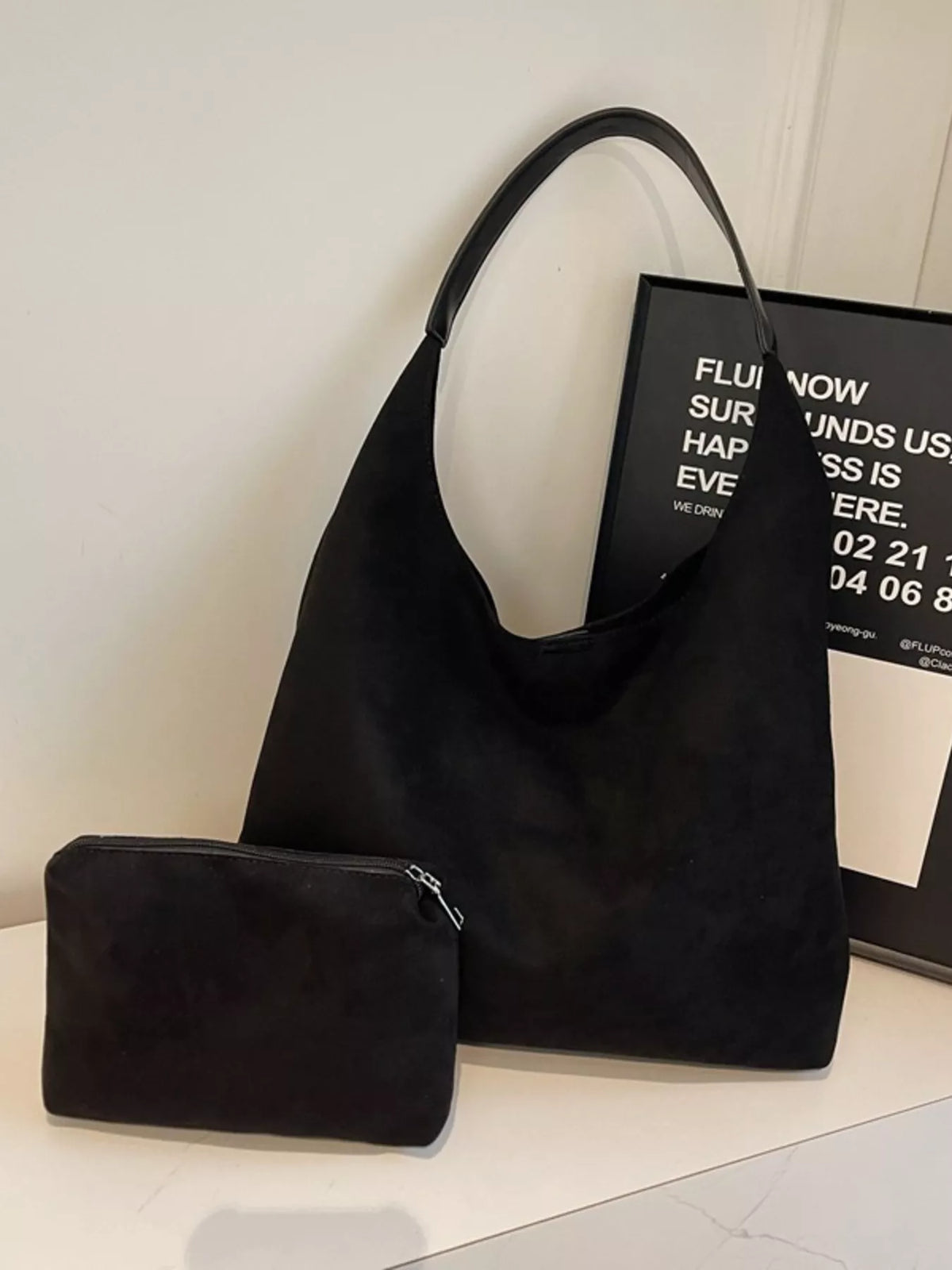 Black suede hobo bag with matching mini pouch and leather strap