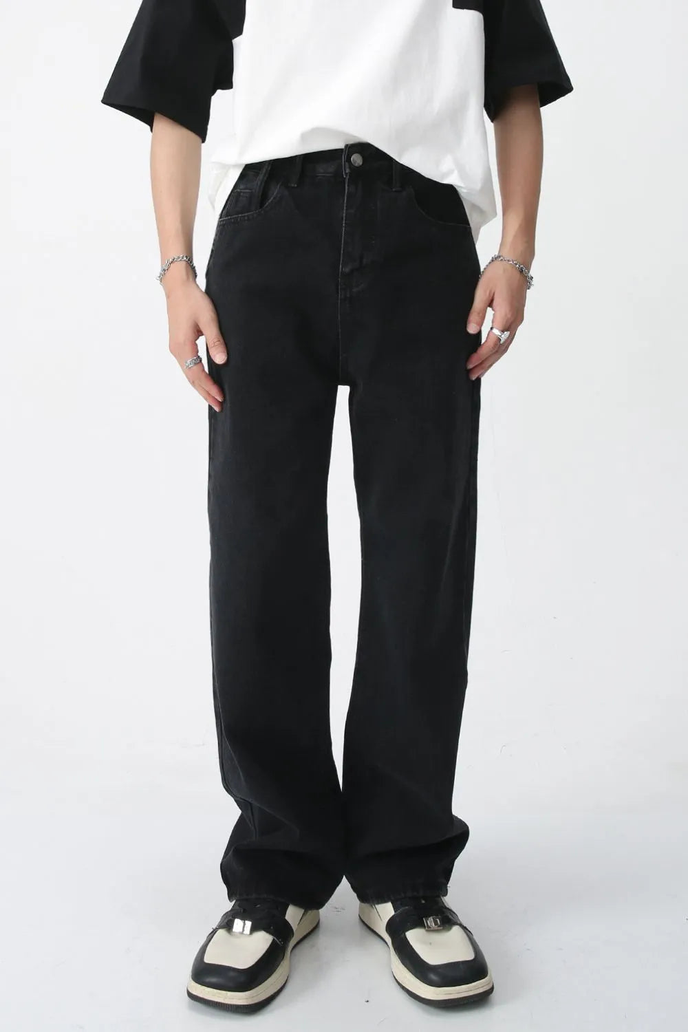 Wide-leg black denim trousers with a relaxed fit and casual style.