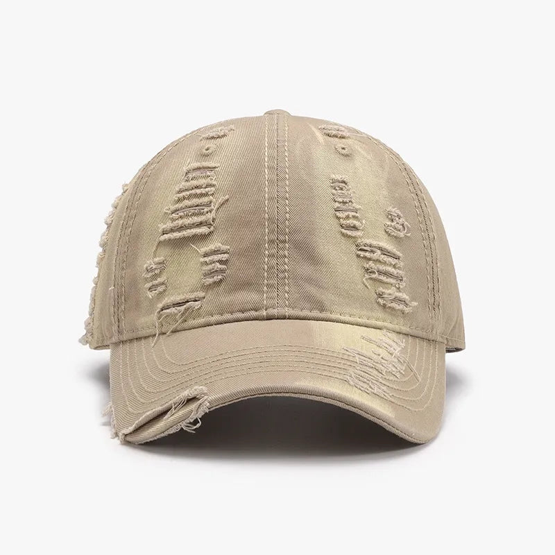 Distressed canvas baseball cap in camel with frayed details and rips.
