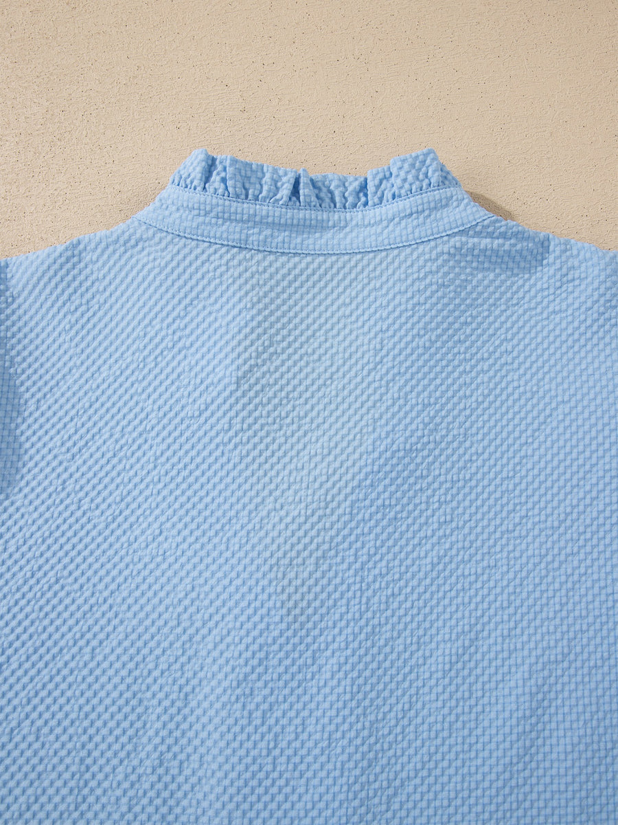 Light blue seersucker blouse with ruffled collar detail