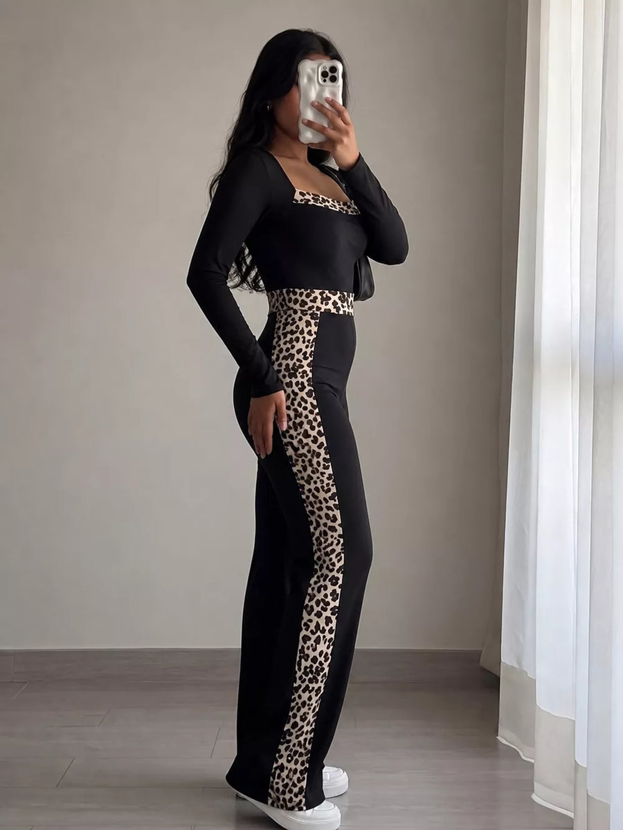 jumpsuit in Black with leopard and leopard trim