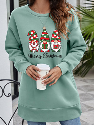Sage green tunic sweatshirt with Christmas gnomes graphic and Merry Christmas text.