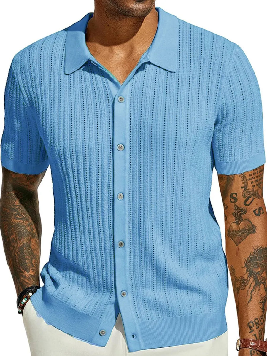 Light blue textured knit polo shirt with openwork detail and short sleeves.