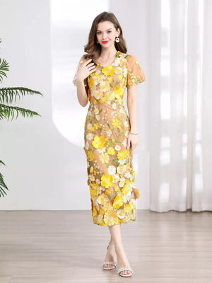 Sheath dress with yellow floral embroidery on sheer fabric, short sleeves, V-neck, midi length.