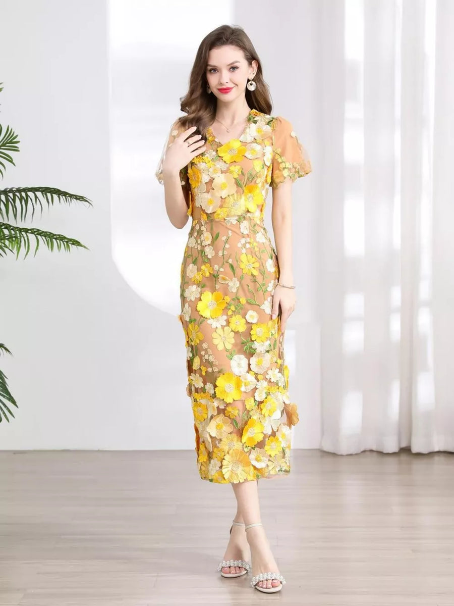 Sheath dress with yellow floral embroidery on sheer fabric, short sleeves, V-neck, midi length.