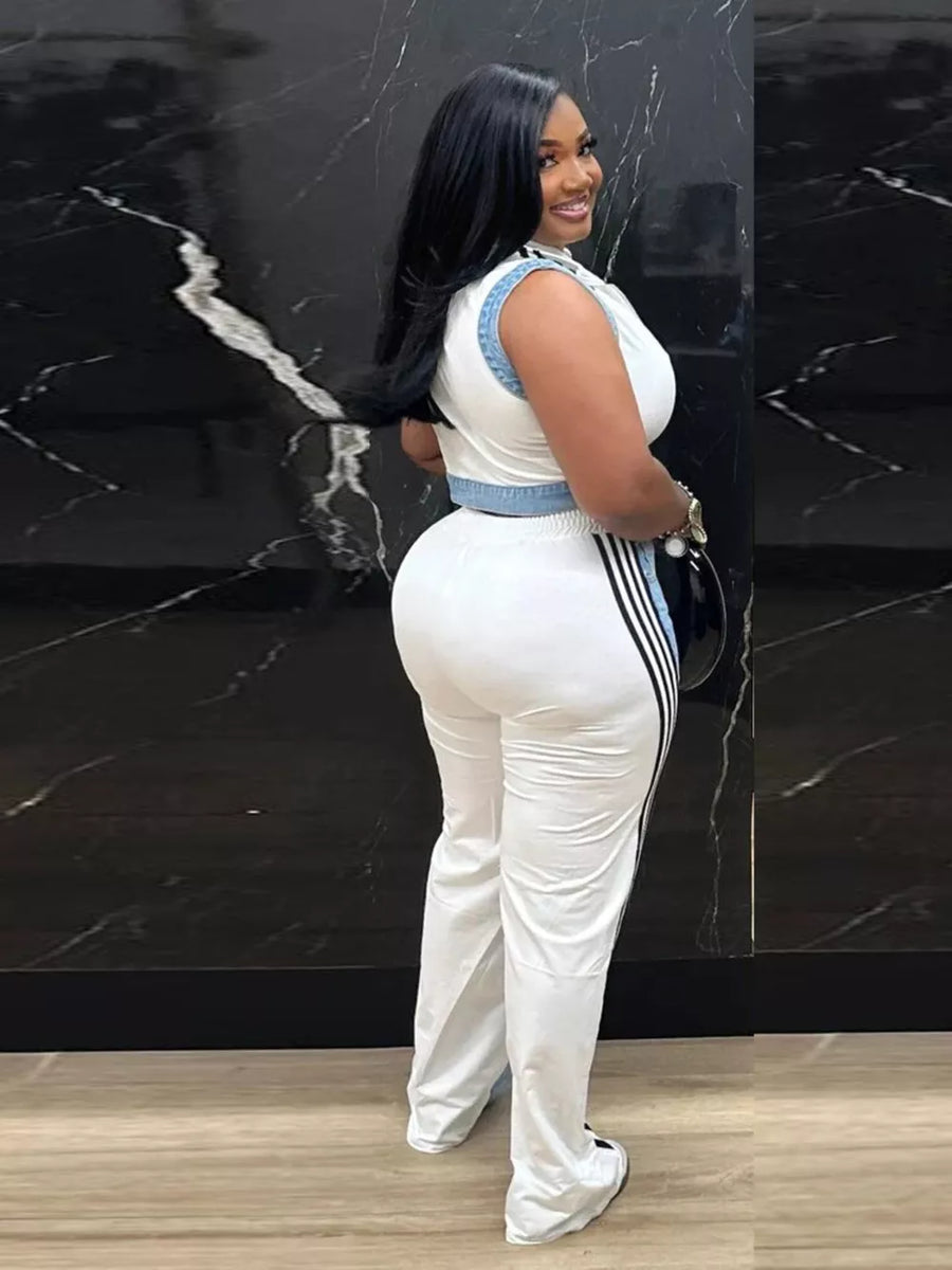 White zip-front crop top and wide-leg pants set with side stripe detail.