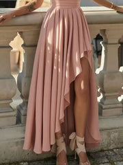 Dusty pink asymmetrical one-shoulder dress with cinched waist and high-low hem.