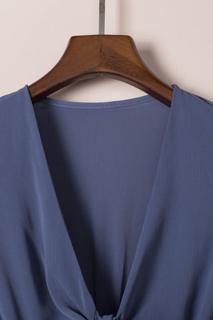Dusty blue V-neck mini dress with ruffled bow-tie detail.