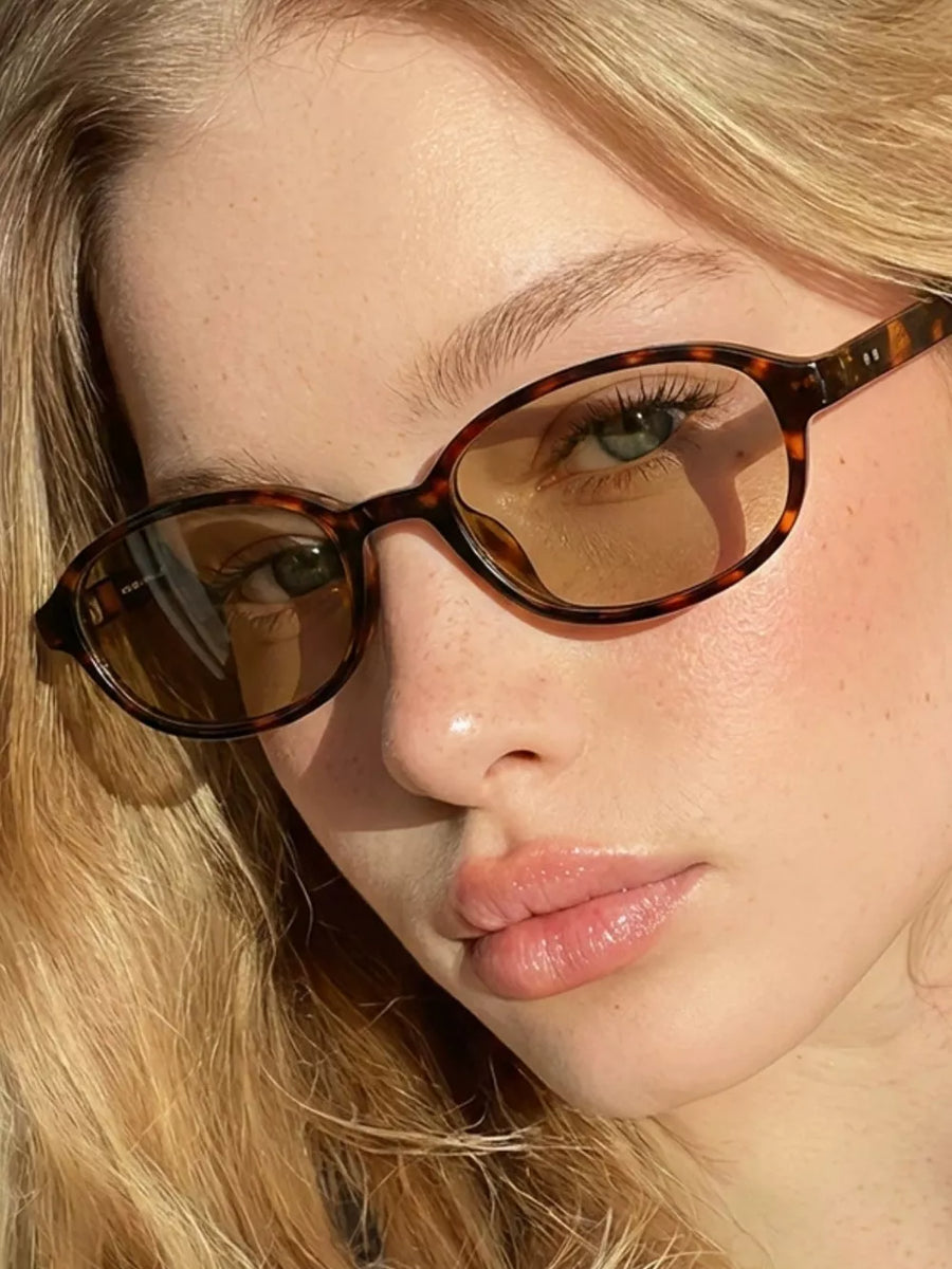 PC Frame material: Polycarbonate Lens material: Polycarbonate Temple material: P sunglasses in Deep Red with oval silhouette