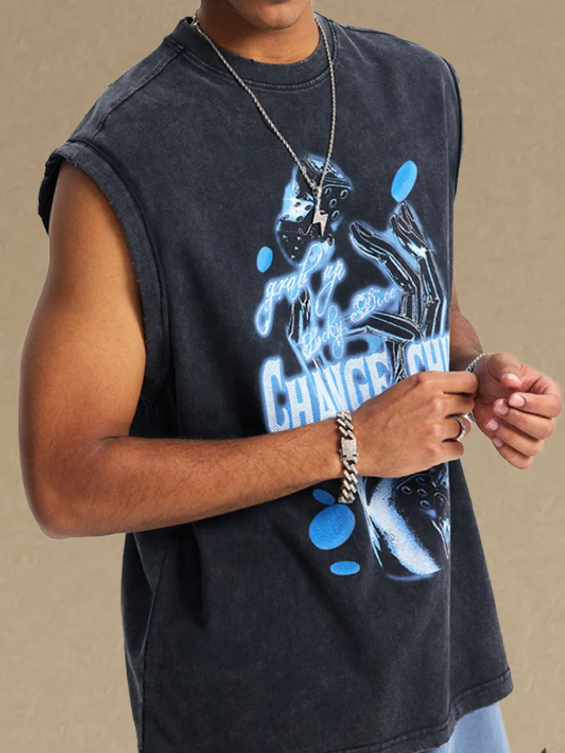 Black vintage wash graphic sleeveless tee with neon blue dice and text graphic.