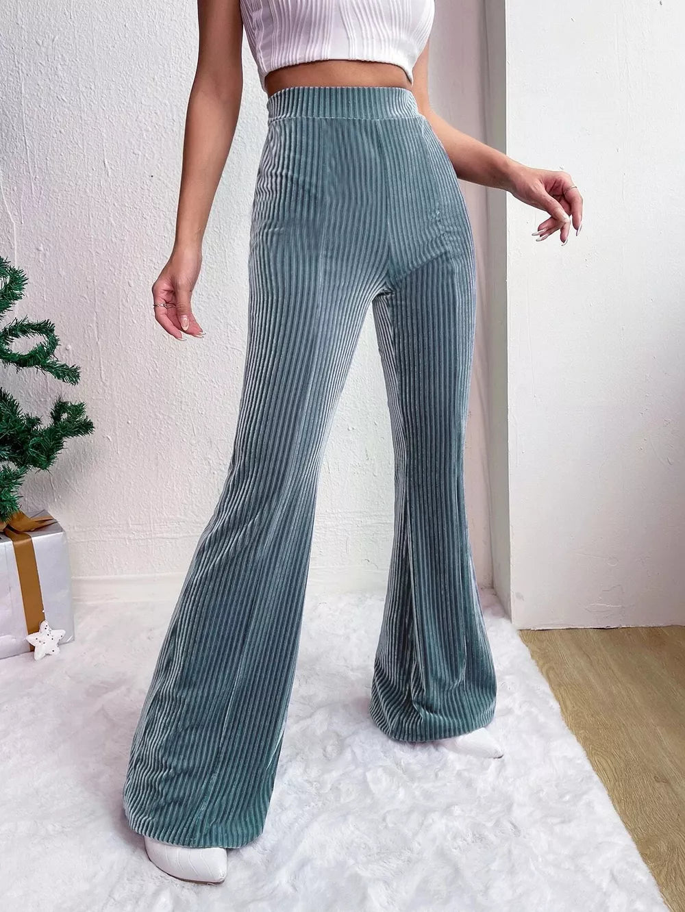 Peacock blue corduroy high-waist flare maternity pants with a ribbed texture.