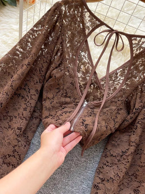 Curry sheer floral lace tie-back cropped shirt with balloon sleeves and zipper detail.