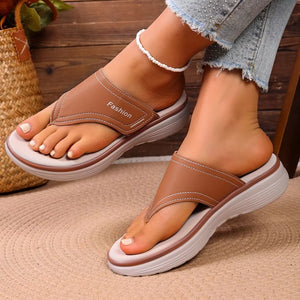 Chic brown toe post platform sandals with white stitching and "Fashion" detail.