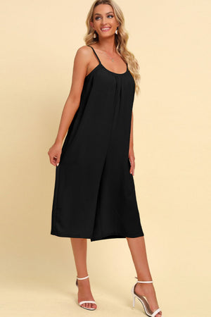 Black culotte jumpsuit with gathered bodice and spaghetti straps.