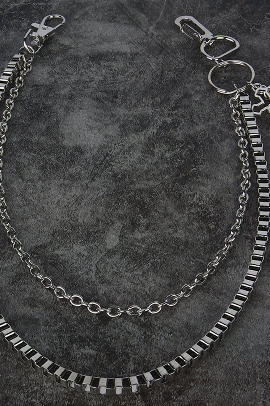 Silver geometric chain waist accessory with multiple chains and a lobster clasp.