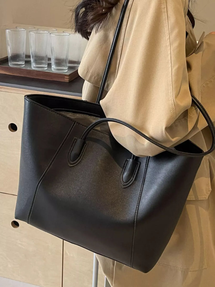 Chic structured black pu leather tote bag with clean silhouette and top handles.
