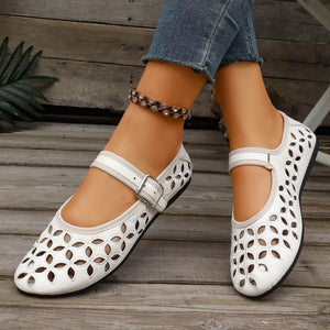 flats in black with floral and round toe